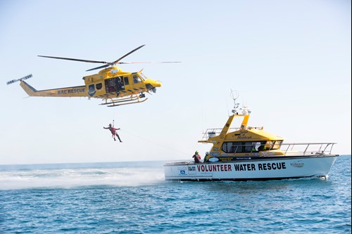 RAC Rescue flies over a marine rescue boat